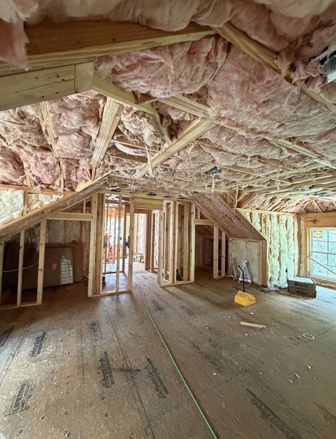 Insulation installation inside a custom home in Southern Shores
