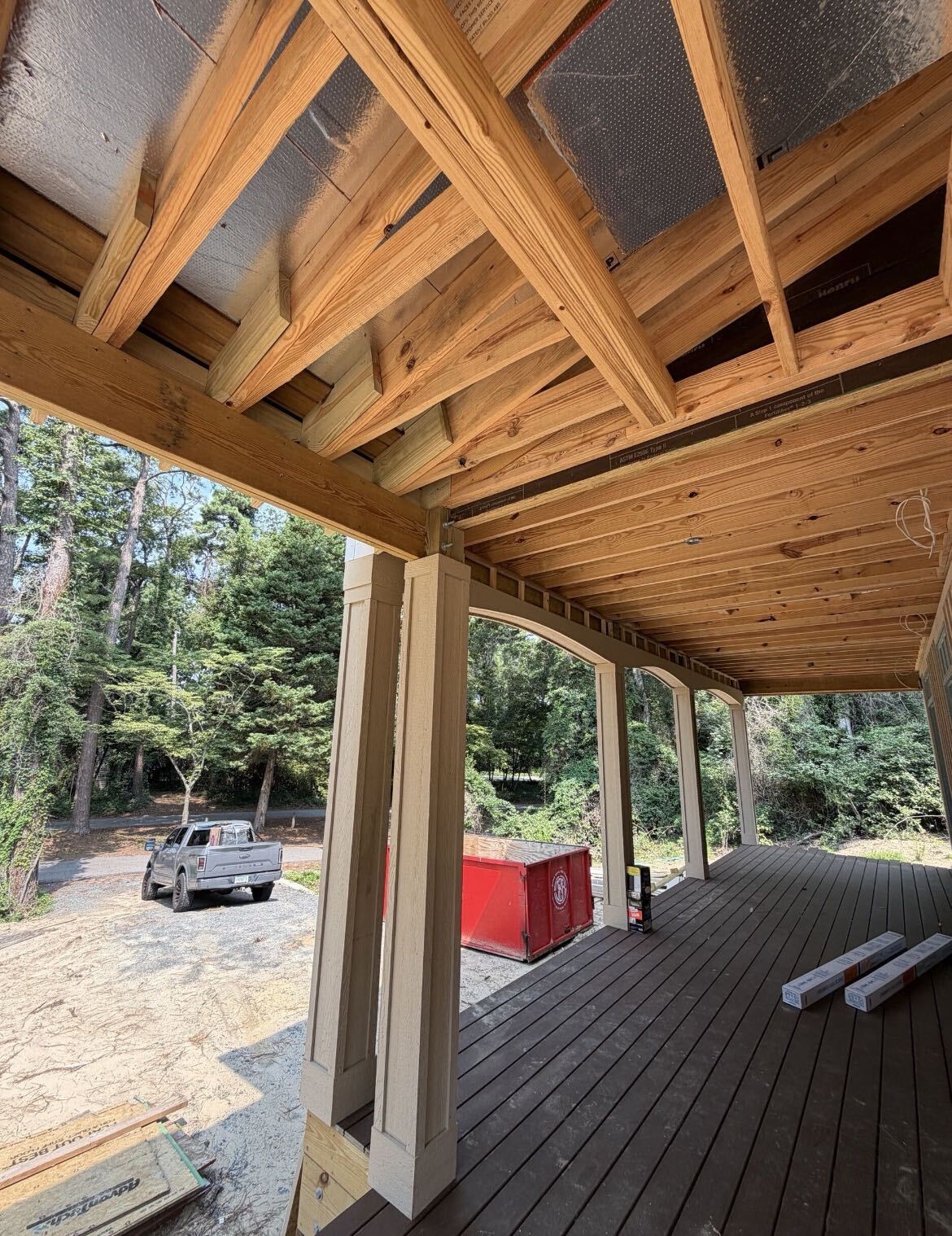 Custom wrapped porch pillings wrapped in LP Smartside for a custom home in Southern Shores