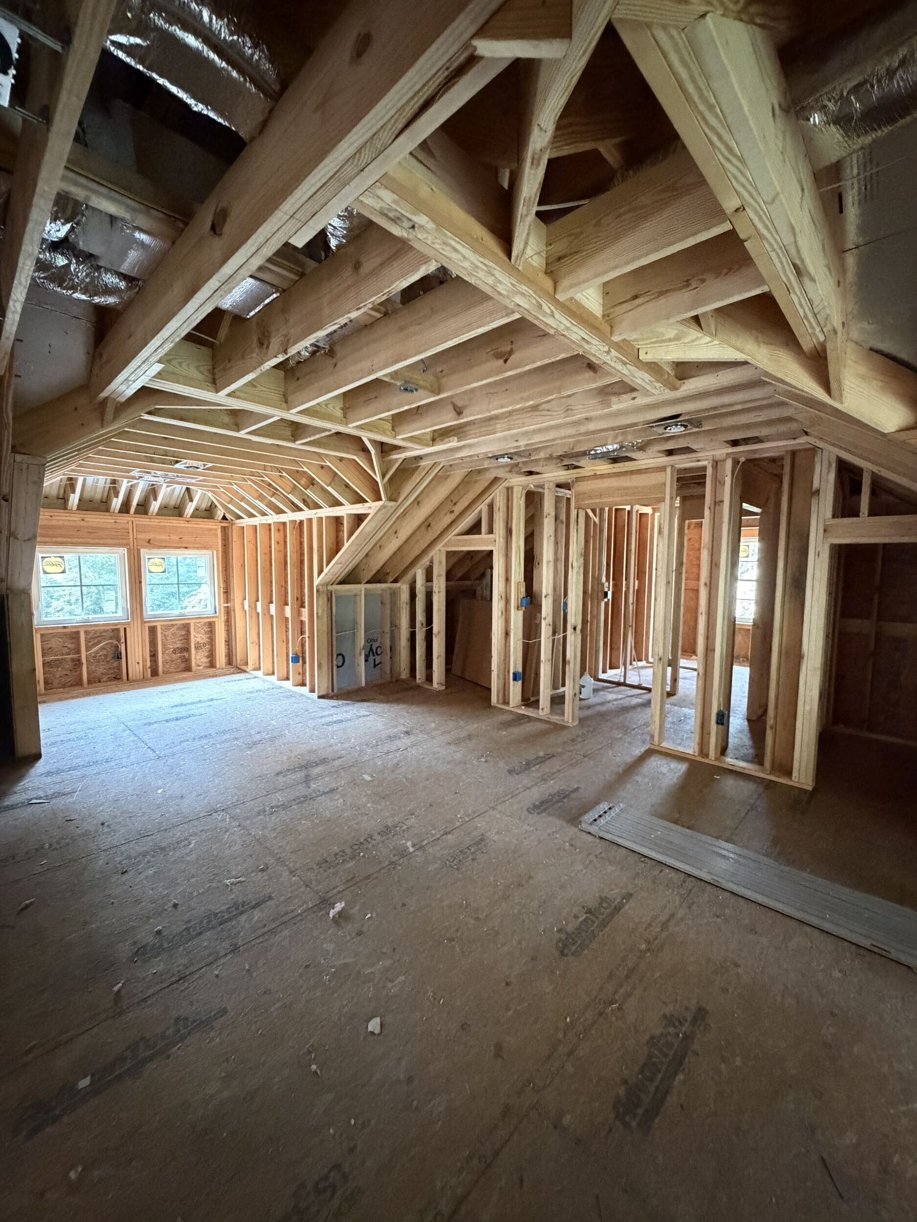 Plumbing, electrical, and HVAC rough-in work inside a custom home in Southern Shores
