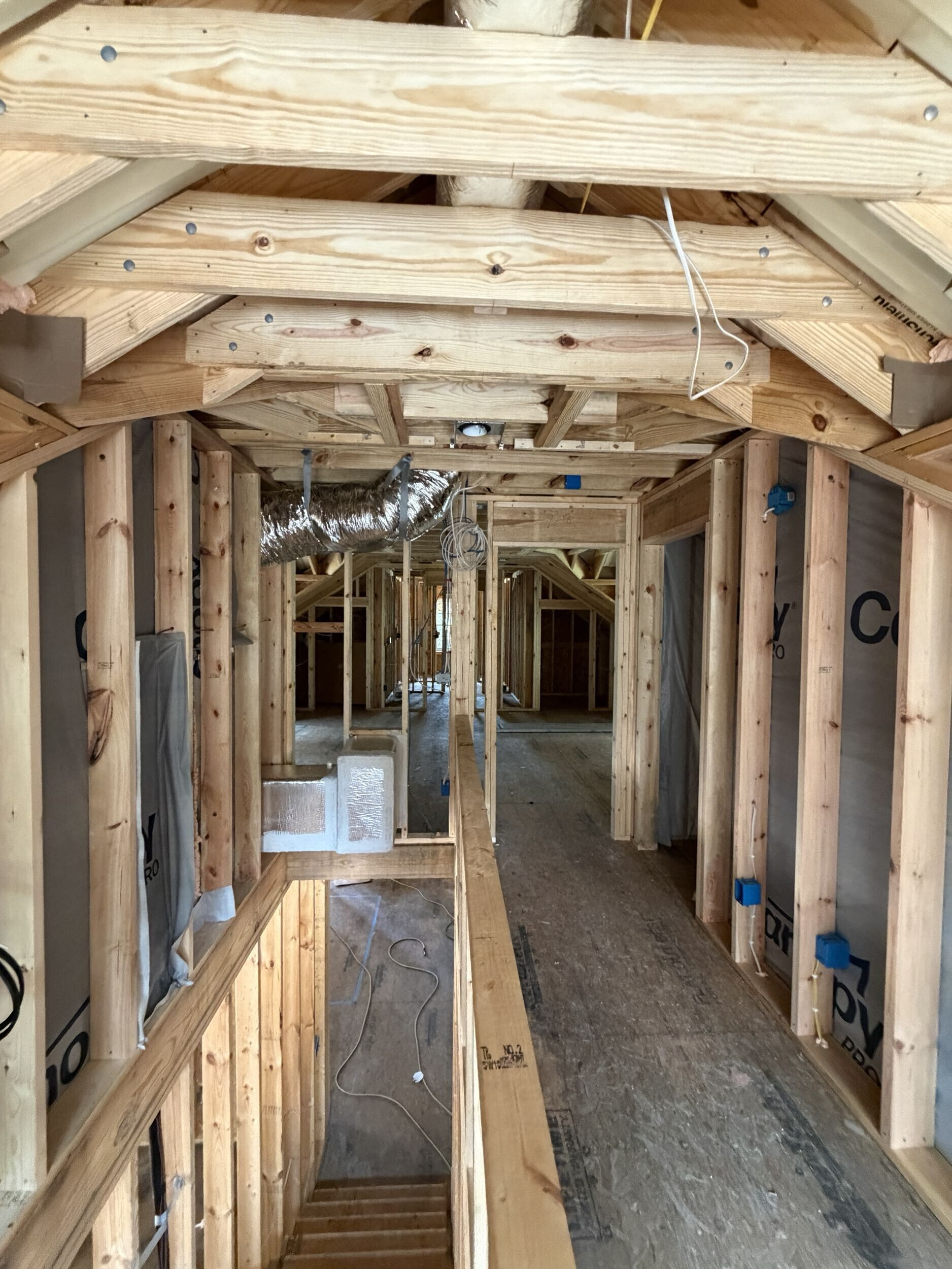 Plumbing, electrical, and HVAC rough-in work inside a custom home in Southern Shores