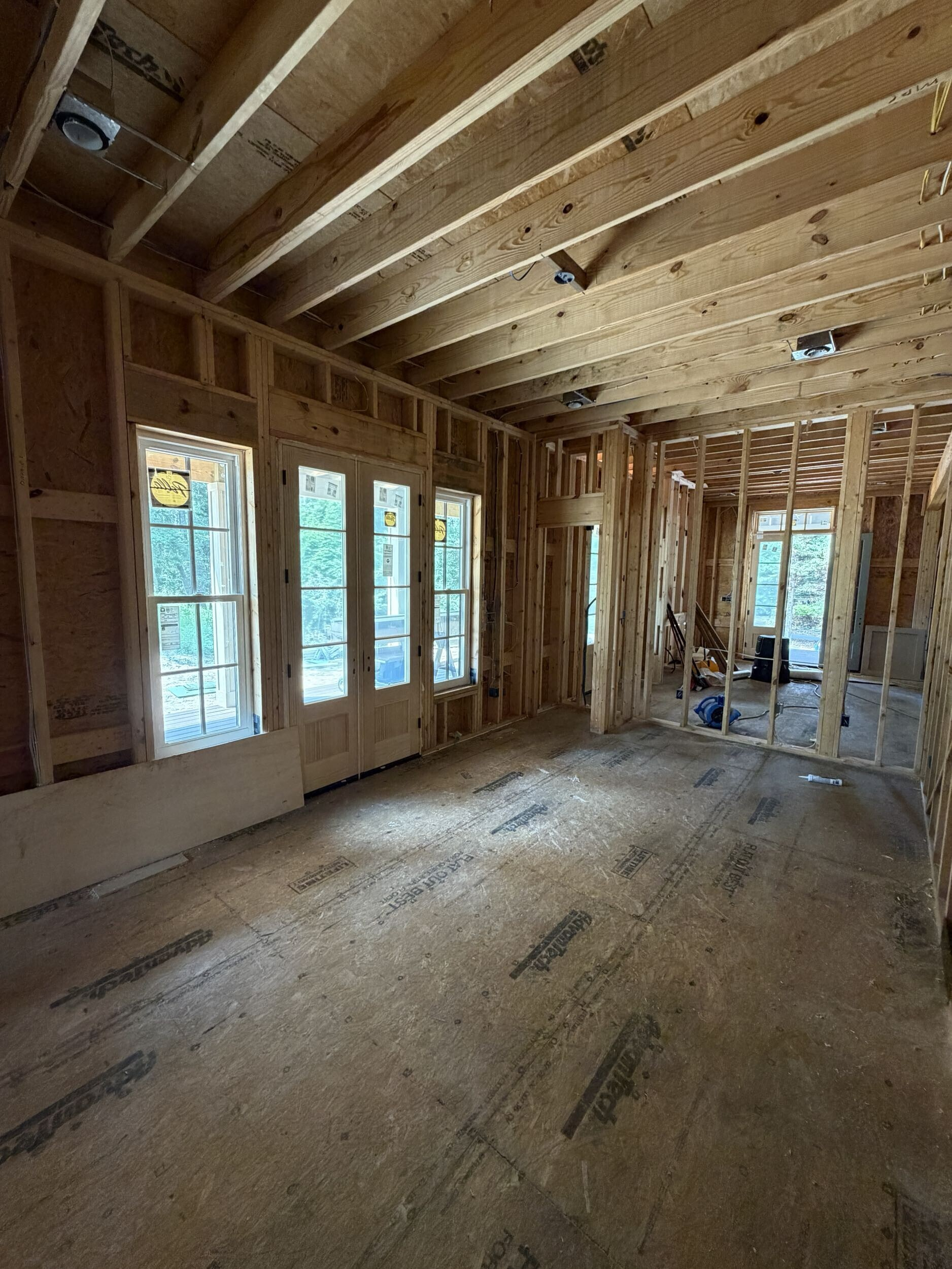 Plumbing, electrical, and HVAC rough-in work inside a custom home in Southern Shores