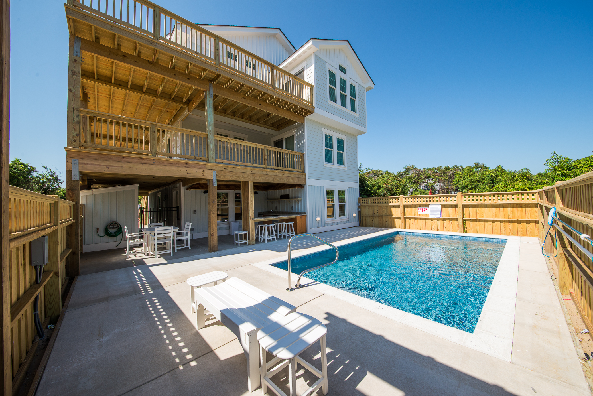 Private pool with outdoor kitchen with granite countertops