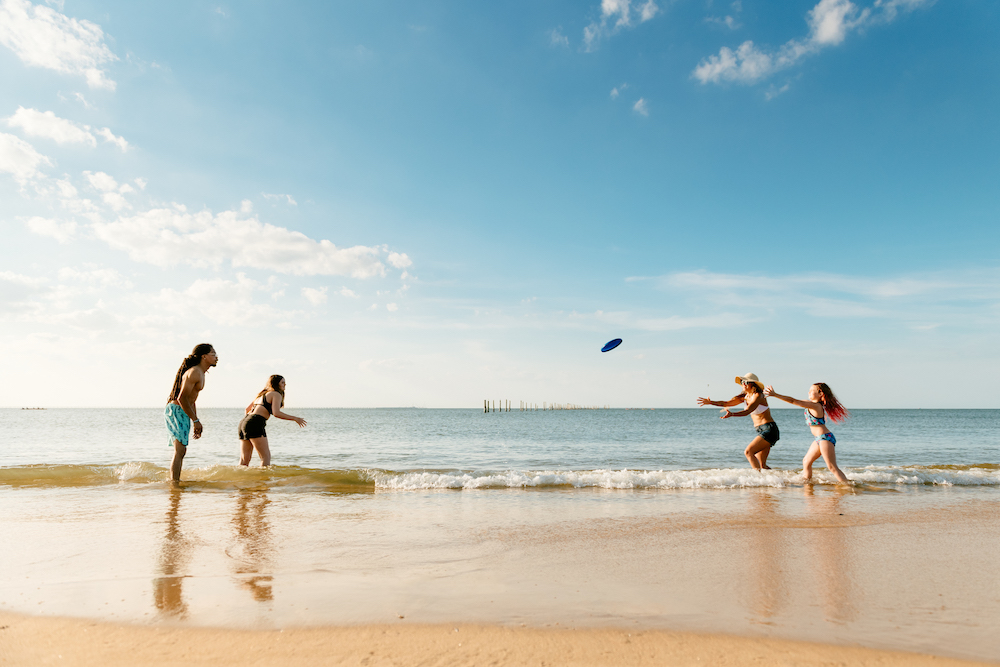 playing frisbee at beach