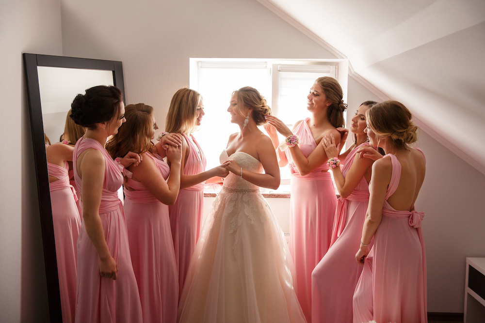 bride getting ready with her bridesmaids