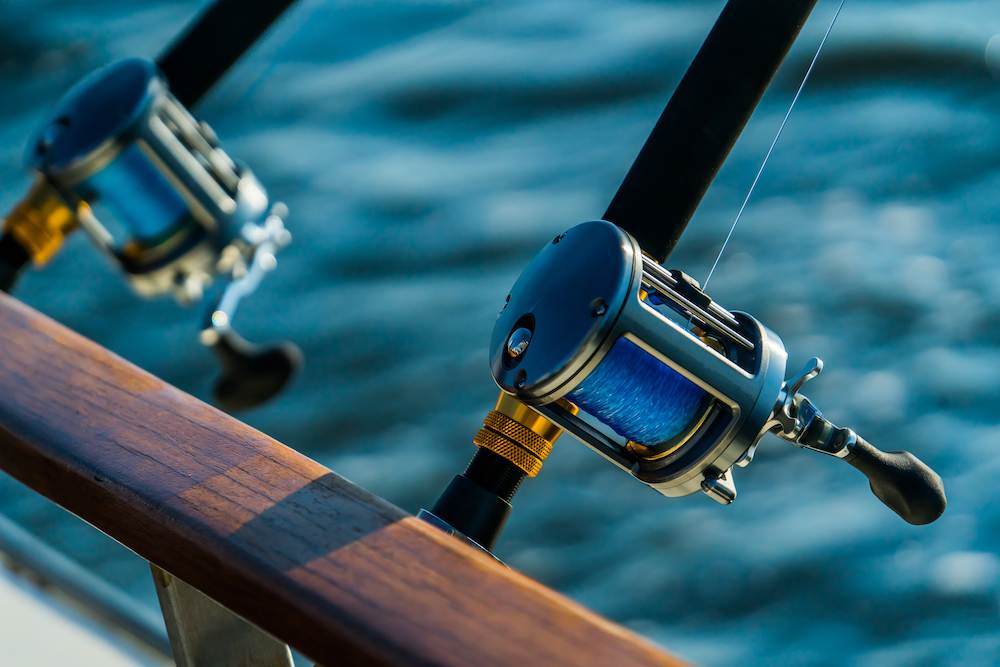 Fishing reels on the side of a boat