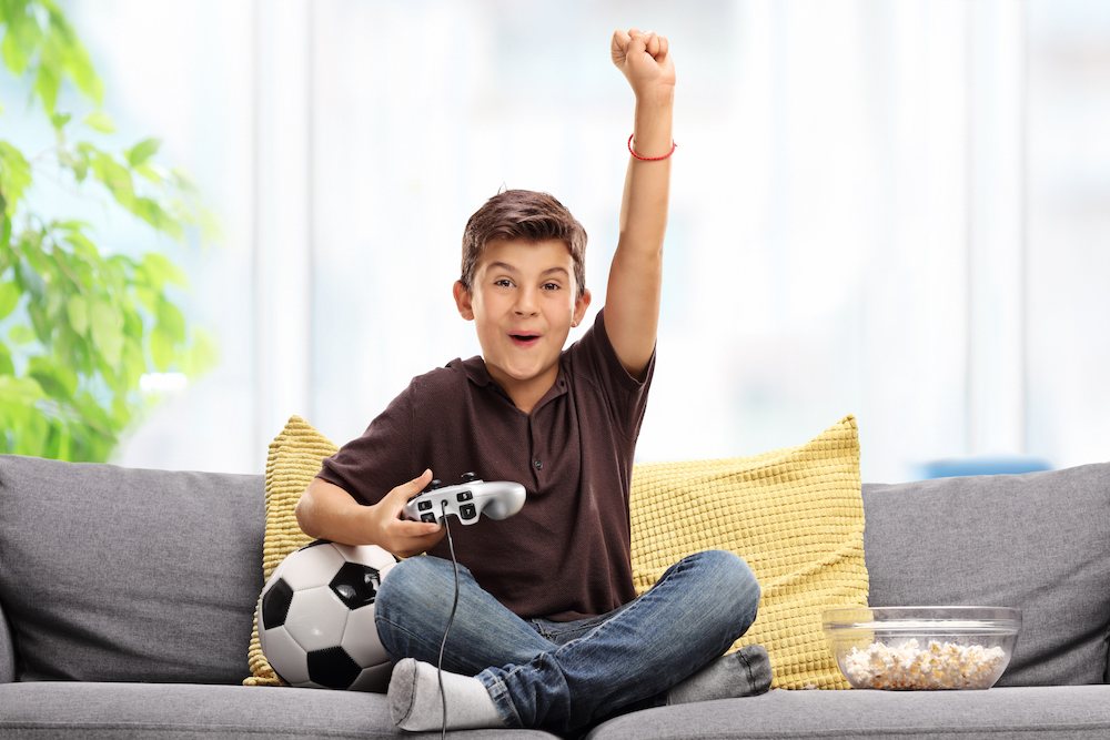 boy playing nintendo 